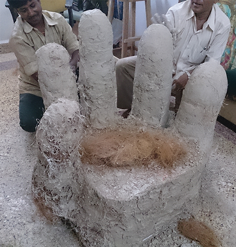 The product was finally given the final touch with Gypsum Stucco plaster, which made it easier for the human hand details to be carved out. The end look was kept raw and not painted to retain the orignality of the finishing material