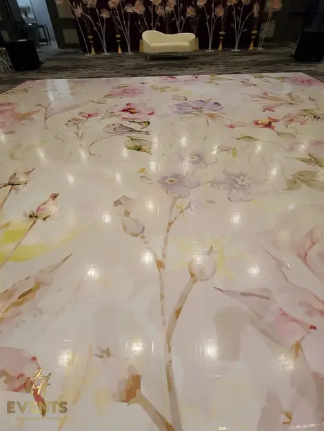 a dance floor with a floral pattern on it