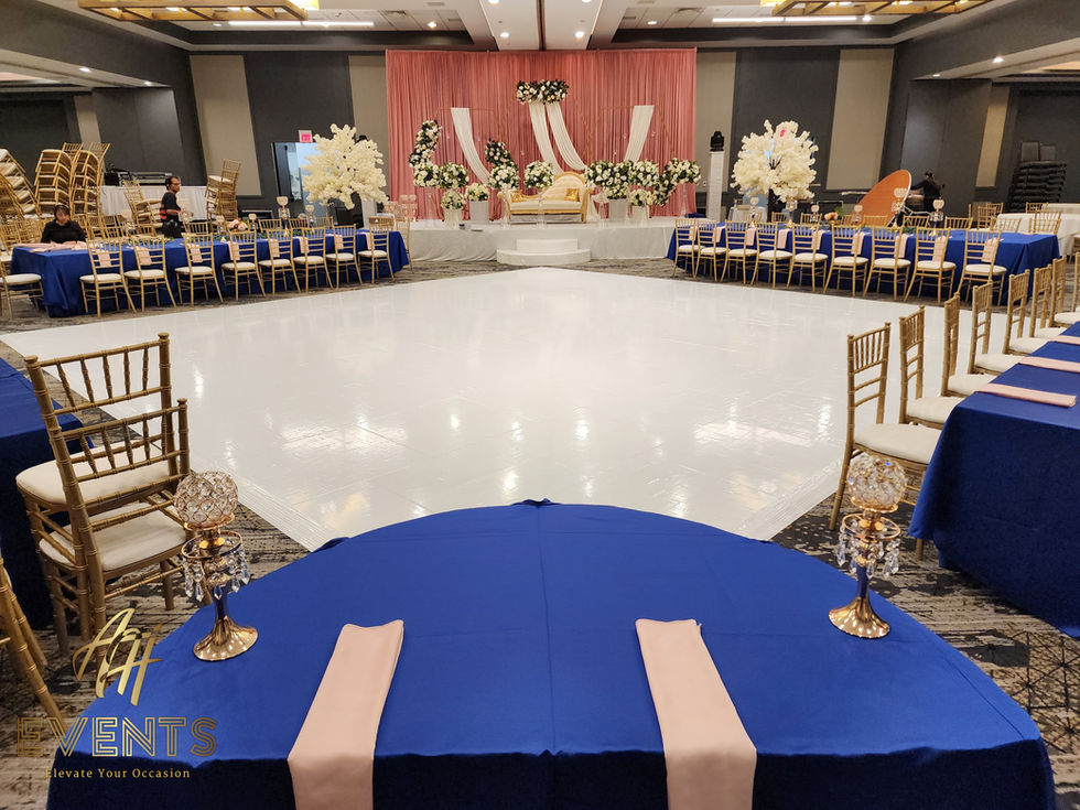 Seamless white vinyl floor wrap for a high-gloss, architectural wedding dance floor finish.