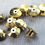 Thumbnail: gold metal locking pin backings for enamel pins