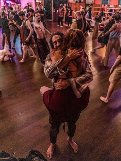 Two people dancing closely at a Seattle Ecstatica event
