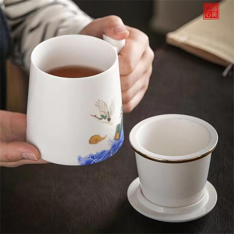 A woman's hands holding a cup of tea.