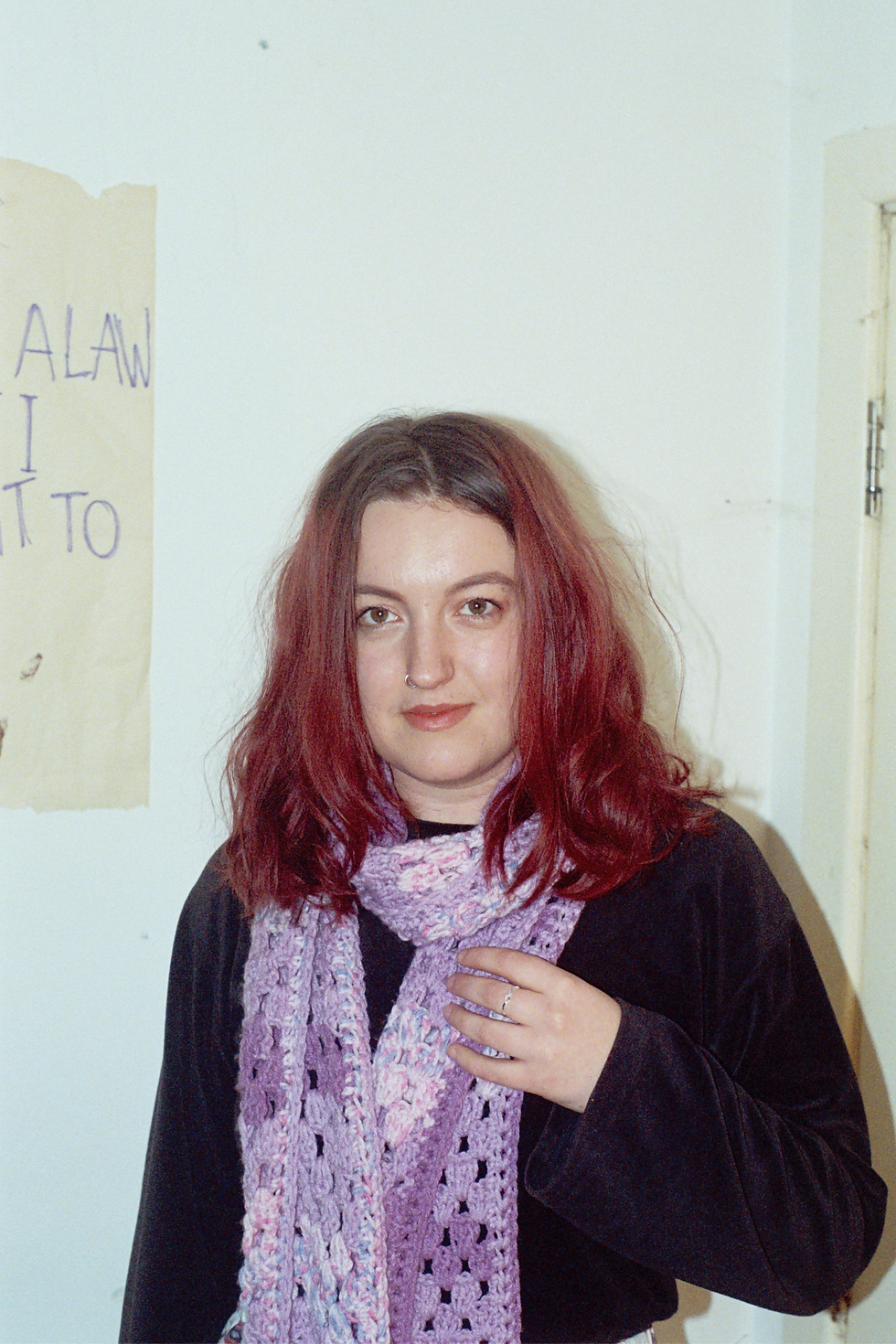 Neve in a purple and pink scarf