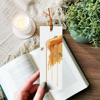 Honeycomb dripping in honey surrounded by honey bees, a coloured pencil drawing by Lucy Gray on a bookmark