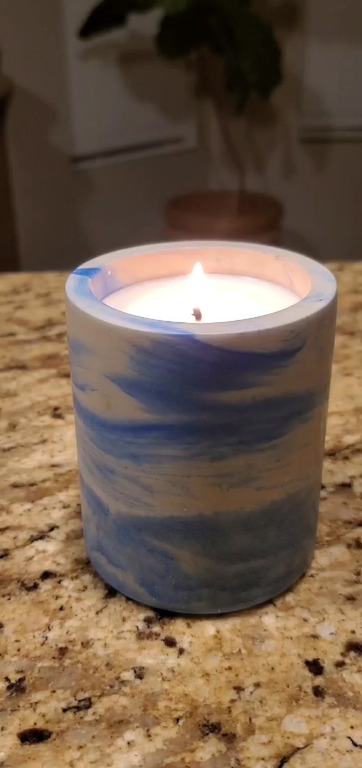Single blue concrete candle on kitchen counter