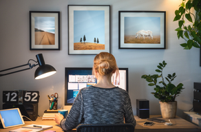 A person working on a computer in a home office