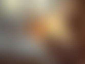 child looking at her ipad in bed