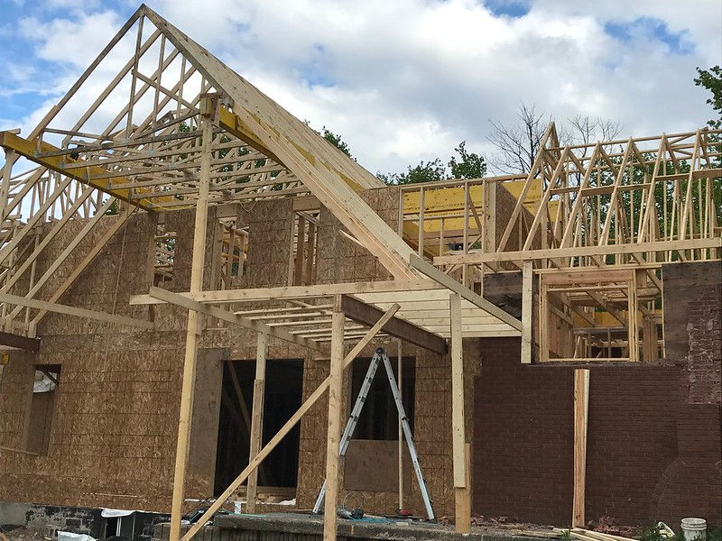 Framing stage of a custom home under construction by Terra CDN Contracting Inc