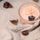 Thumbnail: Pink candle with decorative acorns and leaves on white fabric The Cat & the HoneyBee.