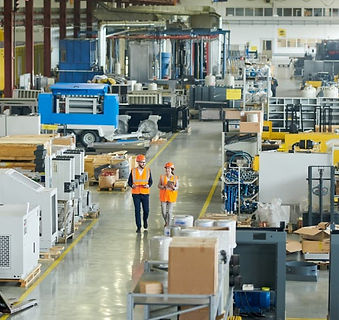 people-walking-through-manufacturing-building.jpeg
