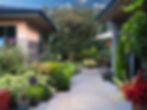 This speculative residence in Spring Hill features a separate DADU above a lower garage that became a landscape designer’s office and was later transformed into a guest house. The DADU works in conjunction with the main home to create a beautiful courtyard where ponds, paths and abundant plant life create a serene communal environment.