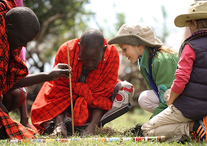 Maasai with tourist kids.jpg