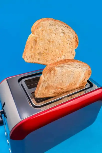 A vintage record player and a modern toaster being tested for shop safety standards.