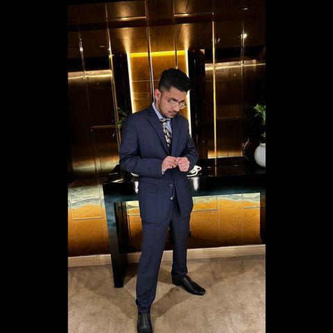 Aditya Agarwal, also known as Addy 323 in navy suit