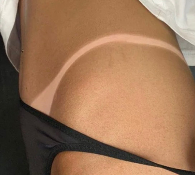 Custom airbrush spray tan at Aruba SunSpa in El Paso