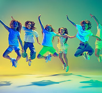 High jump. Group of children, little girls in sportive casual style clothes dancing in cho
