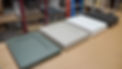 Different color door fronts side by side on a table