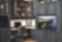 A dark grey closet system that is an all in one with a desk section and a wall bed