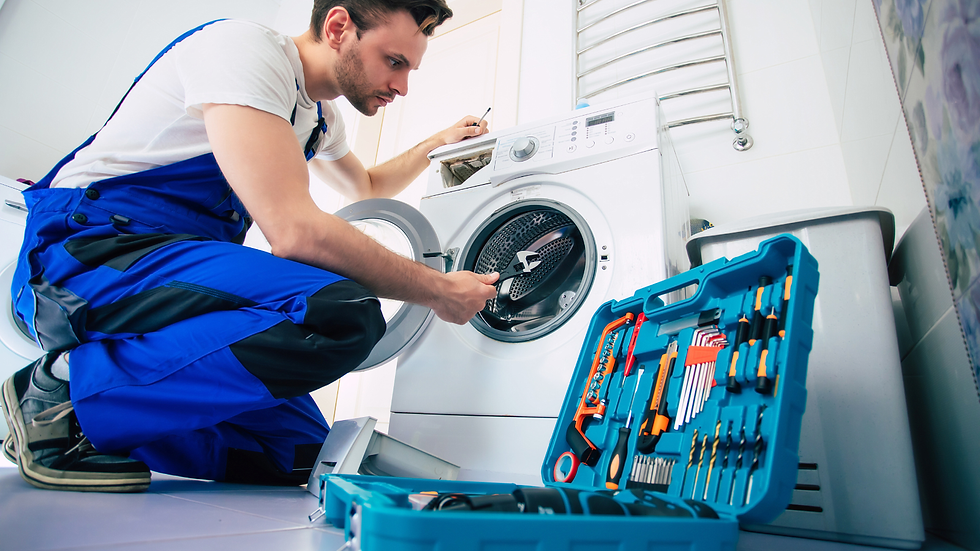 A service tech repairs a washer on-site – the behind-the-scenes logistics that make “service included” in the rent-to-own service model more than a promise.