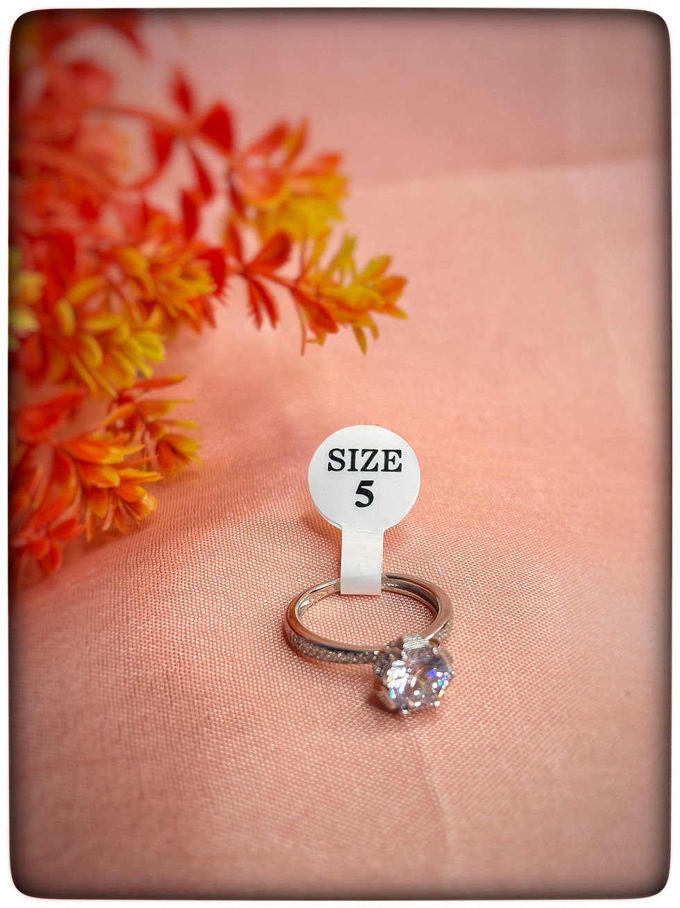 925 sterling silver solitaire engagement ring with a central stone and side accents, available in size 5 – Tanyam Jewellers