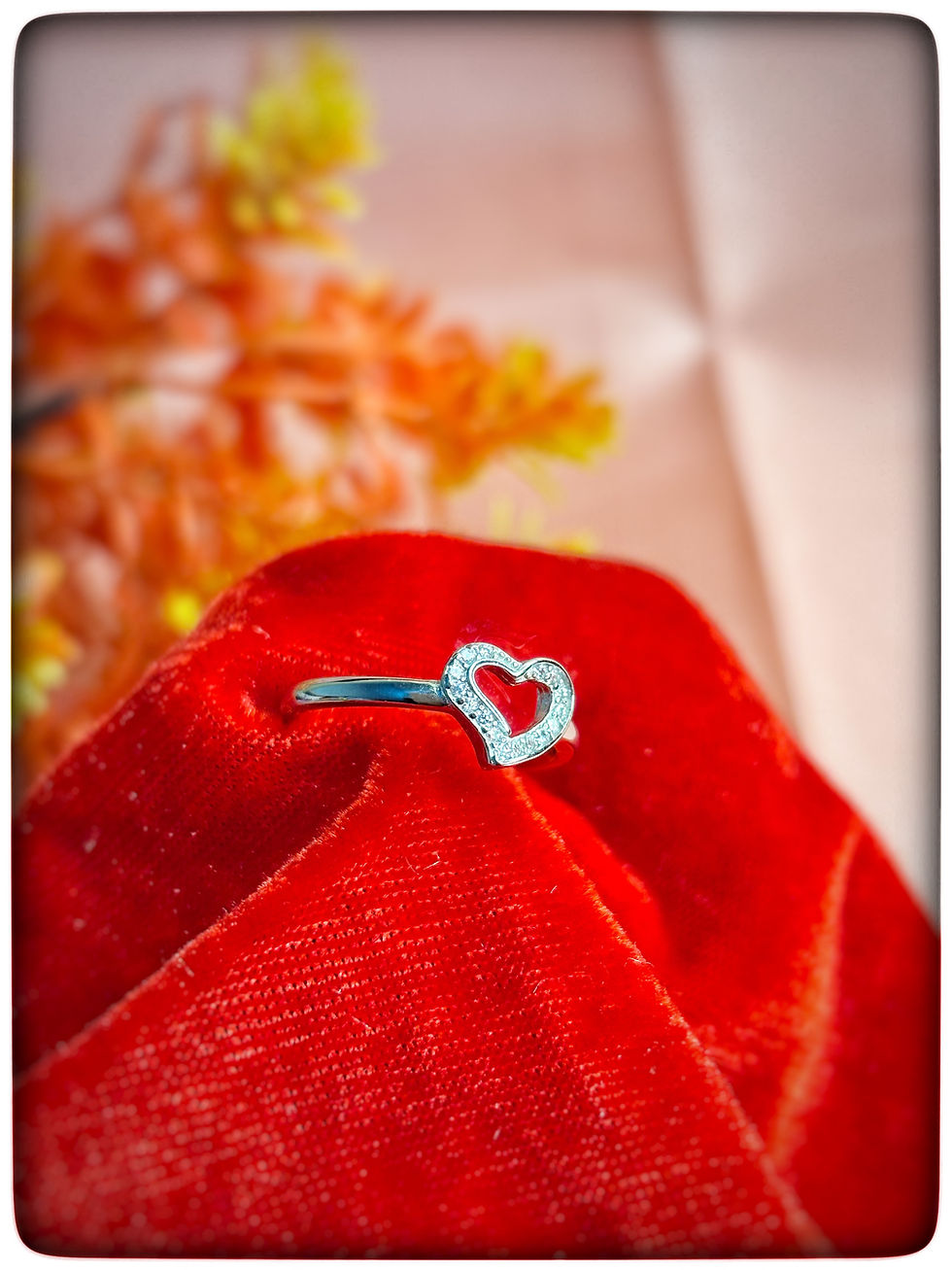 925 Sterling Silver Heart Ring with Sparkling Stones on Peach Fabric