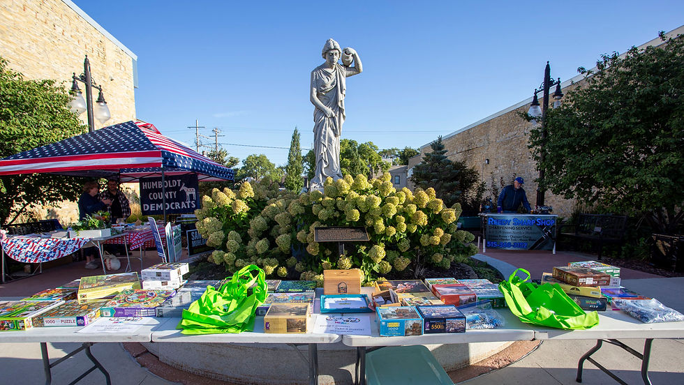 puzzle swap tables in front of statue