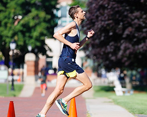 A runner on the course at Stonehill College during the 10k and half marathon at the Narragansett Summer Running Festival.