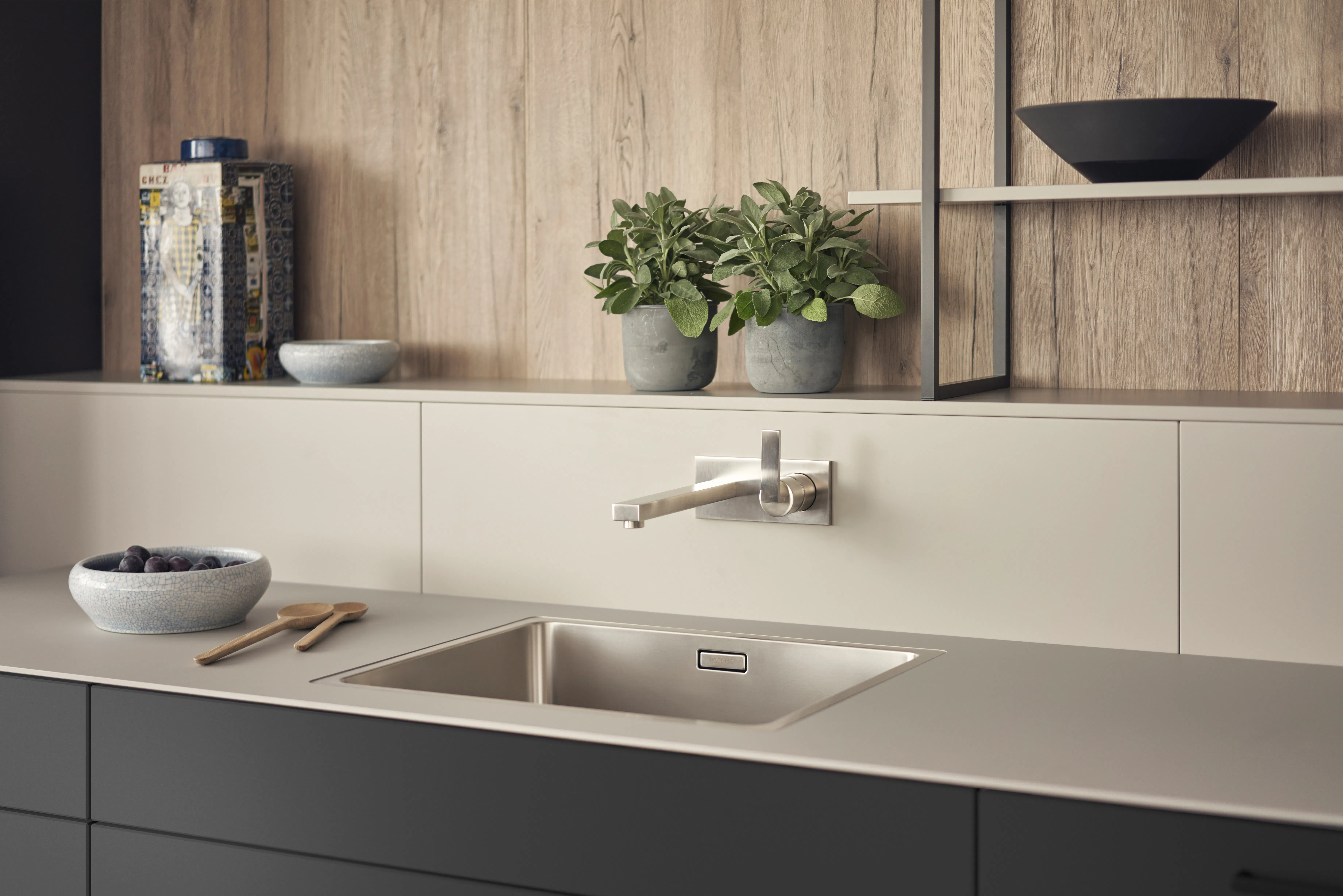 Open shelving in a minimalist kitchen, showcasing simple, functional decor.
