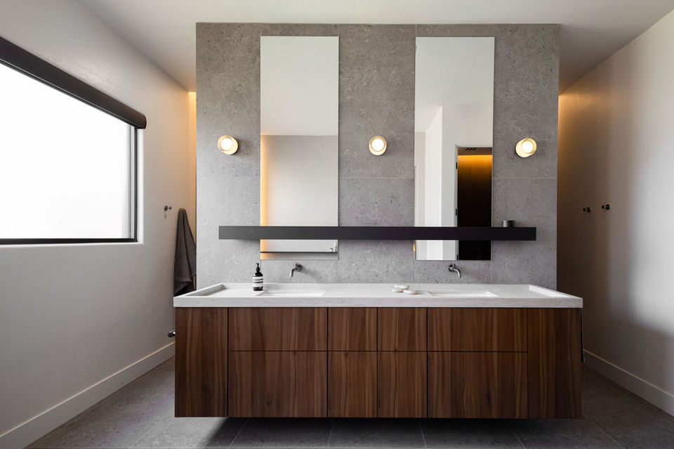 Lounge kitchen with a sleek island and modern barstool seating
