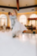 The groom lifting the bride during their first dance.