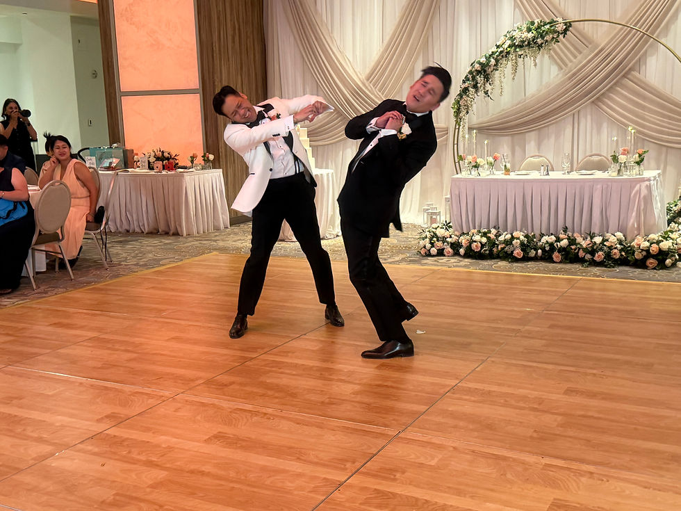 2 grooms dancing first dance
