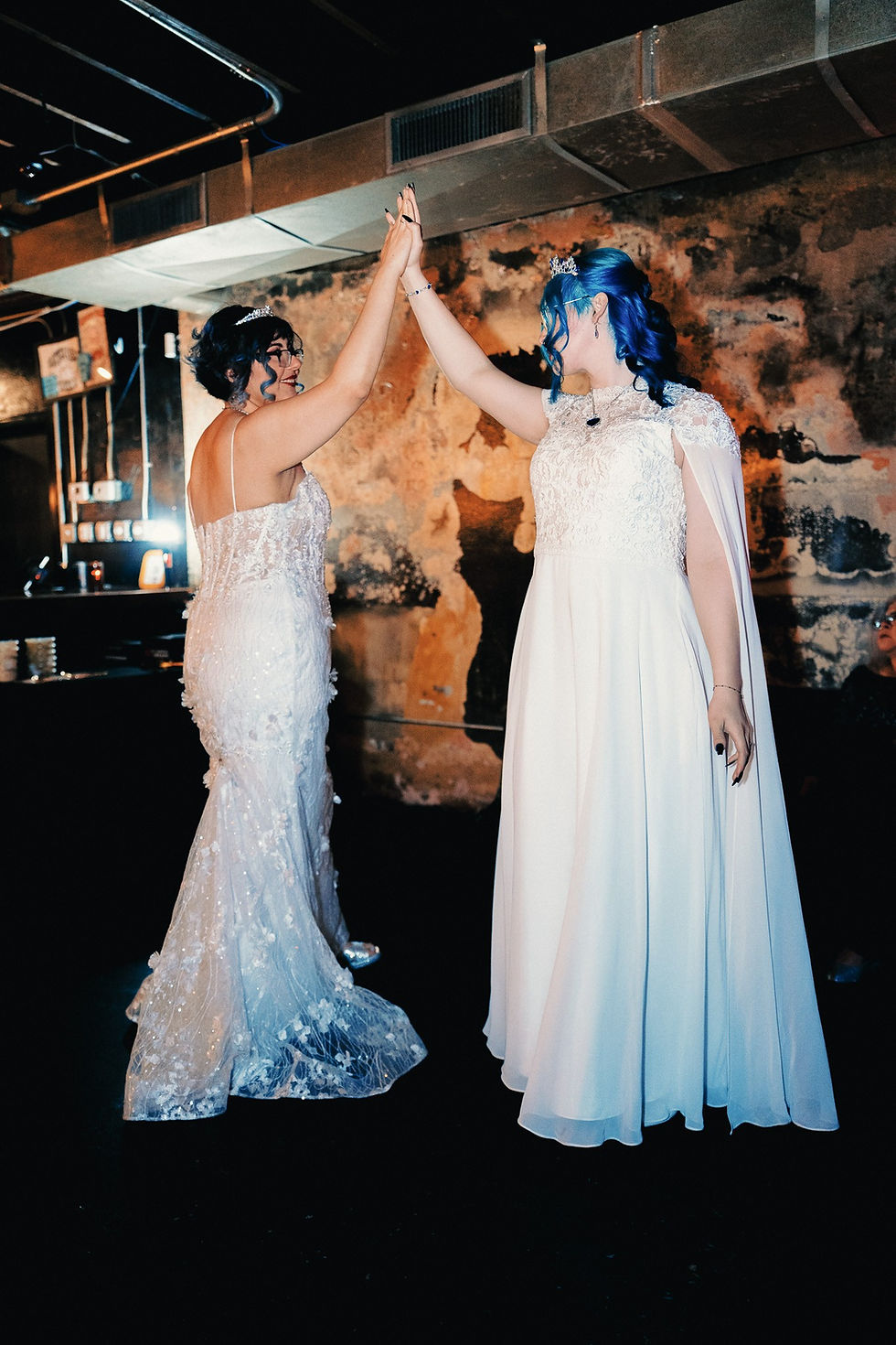 Two brides immersed in their first dance.