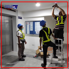 Technician installing DVR and IP CCTV systems