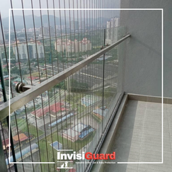 Worried parent looking at unsafe condo balcony before grille installation