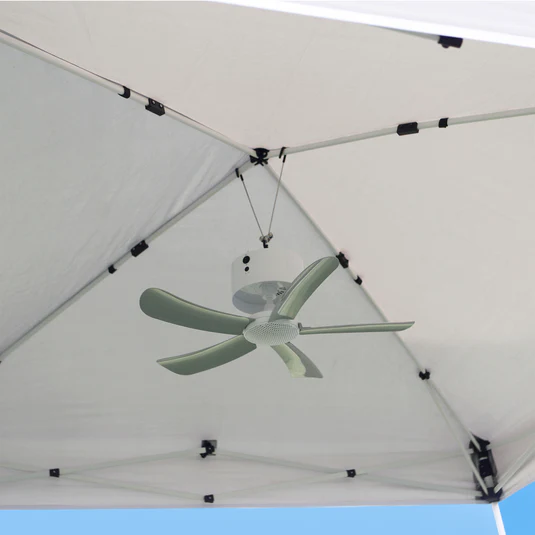 Wall-mounted tent fan installed for kenduri canopy cooling
