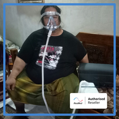 Relaxed Asian man waking refreshed after CPAP therapy