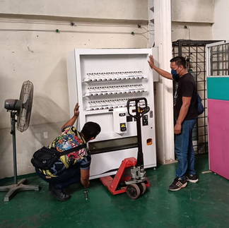 Monthly vending machine service schedule posted on cabinet