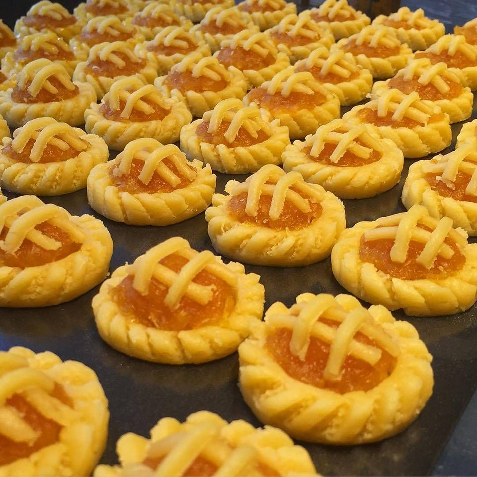Golden pineapple tarts served on decorated plate in Selangor