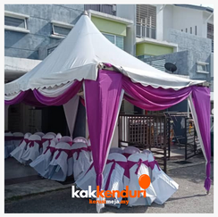 Modern tower air cooler operating beside outdoor event seating area
