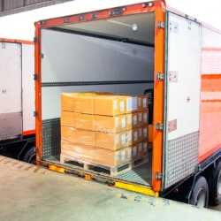 goods are being placed in a truck