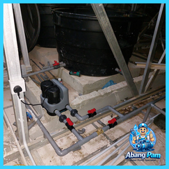 Clean professional water pump installation with organized piping