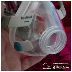 Patient sleeping comfortably using a CPAP machine after treatment