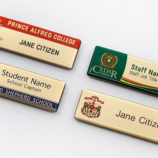 Name card with QR code being trimmed at local print shop