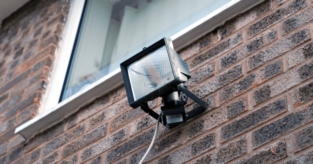 Home security alarm system with motion detector in living room