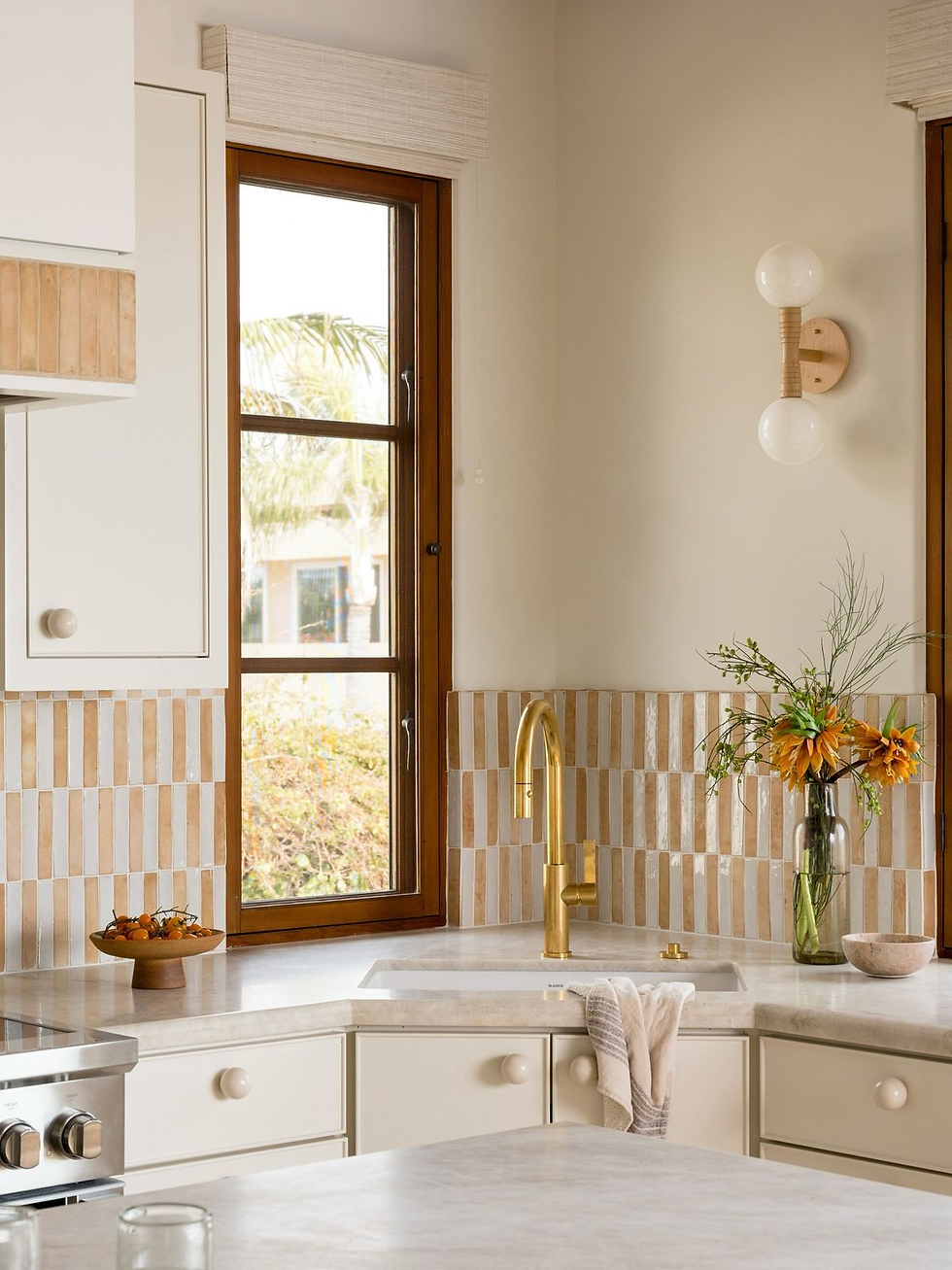 Earthy tone exterior paint on small house with concrete wall