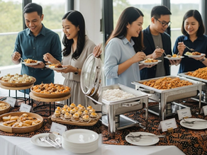 Catering team setting up food for small office event