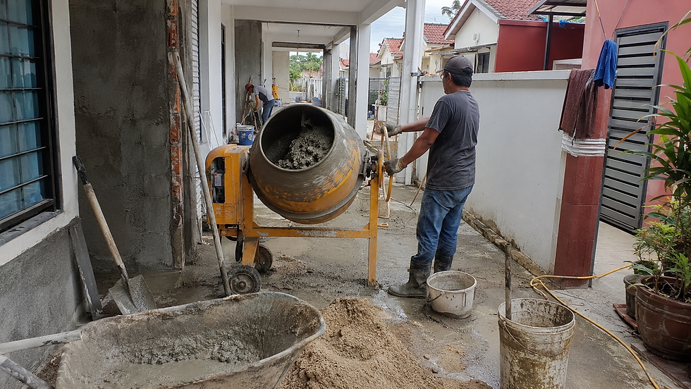 Portable 125L cement mixer working in narrow renovation space