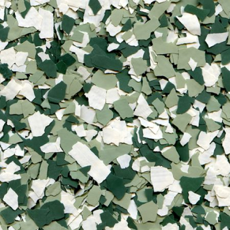 Epoxy colour flakes being scattered evenly across a wet base coat in Malaysia.

