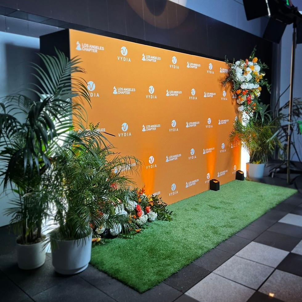Classic red carpet and gold rope backdrop setup for gala dinner