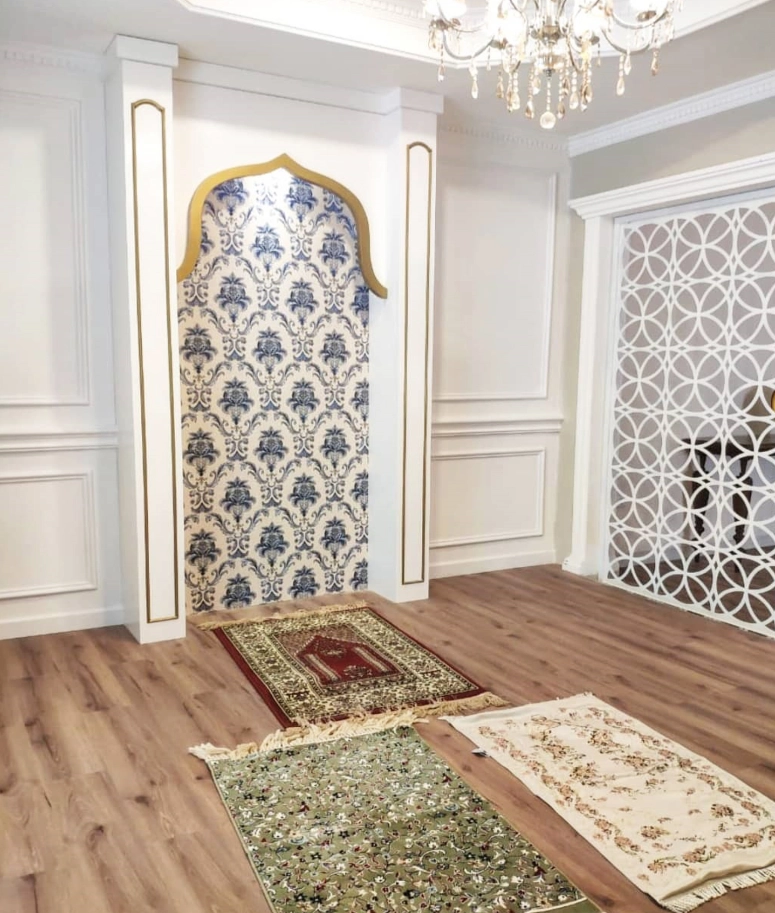 Stylish wooden partition board separating living room from prayer area